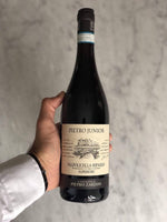 Zardini Valpolicella Ripasso Classico Superiore bottle of wine being held over light gray background